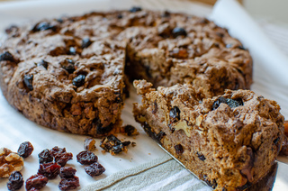 Fruit cake with raisins, dried cranberries, walnuts and dates