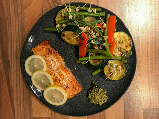 Grilled salmon and vegetables with garlic-tahini sauce